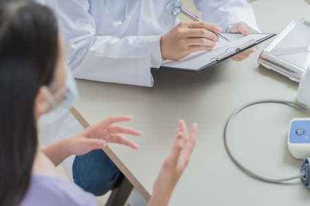 Doctors and patient talking about therapy. Asian peopleの写真素材