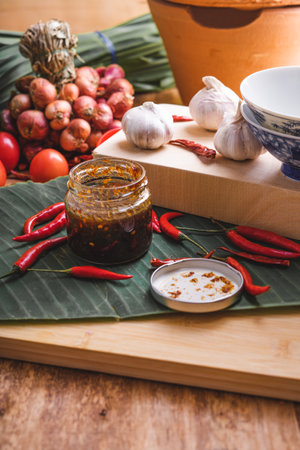 Various fresh vegetables and spices on wooden tableの写真素材