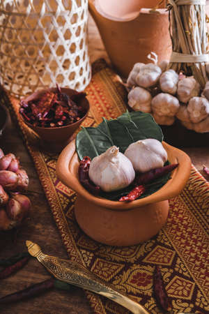 Various fresh vegetables and spices on wooden table, Thai food conceptの写真素材