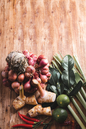 Various fresh vegetables and spices on wooden tableの写真素材