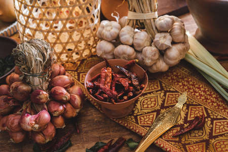 Various fresh vegetables and spices on wooden table, Thai food conceptの写真素材