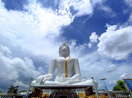 White Big Buddha Landscape, Rai Khing Temple in Thailand, towering and beautiful with bright sky background, religious cultural attraction.の写真素材