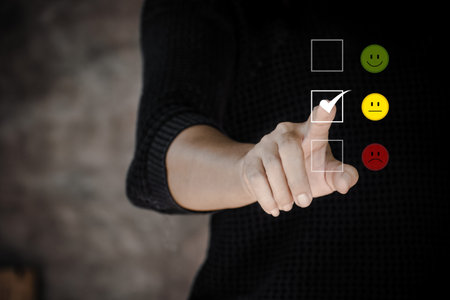 Customer service and Satisfaction concept ,Business people are touching the virtual screen on the happy Smiley face icon to give satisfaction in service. rating very impressed.の写真素材