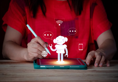 Smart woman using tablet with artificial intelligence icon on screen. Technology and innovation concept. convesation with AI.の写真素材