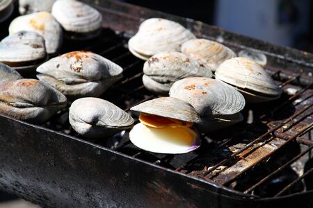 Shellfish on a grill during a street festival