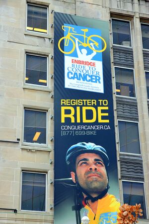 Toronto, Canada, November 24, 2011 - The Conquer Cancer Ride advertisement on a building in Toronto.