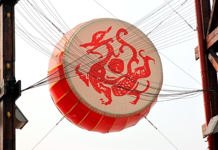 Chongqing, China, March 18, 2012 - A large Chinese drum above a square in Chongqing.のeditorial素材