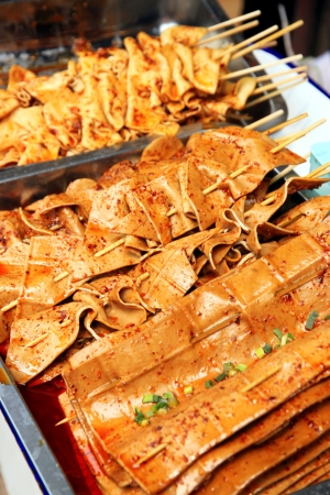 A stand selling tofu skewers in Chongqingの写真素材