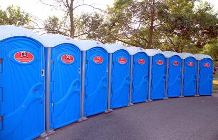 Toronto, Canada, July 7, 2012 - A line of portable toilets at an outdoor eventのeditorial素材