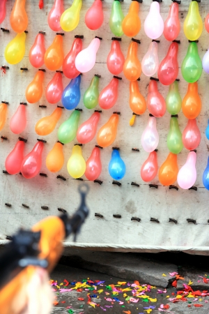 Fenghuang, China, March 23, 2012 - A street shooting range game in Chinaのeditorial素材