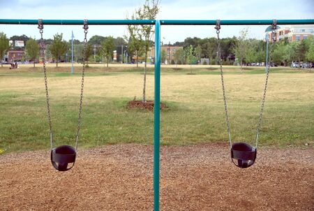 Toronto, Canada, July 22, 2012 - Two swings in a park in Torontoのeditorial素材