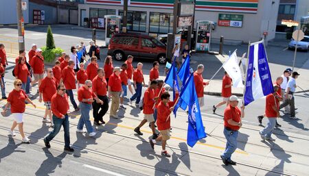 Toronto, Canada, September 3, 2012 - People marching during the 2012 Labor Day Parade in Torontoのeditorial素材