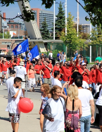 Toronto, Canada, September 3, 2012 - People marching during the 2012 Labor Day Parade in Torontoのeditorial素材