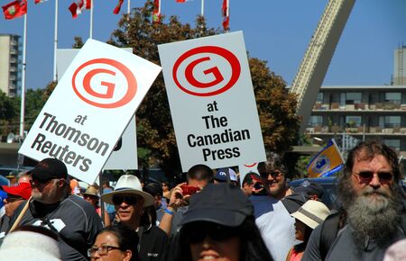 Toronto, Canada, September 3, 2012 - Media employees marching at the annual Labor Day Parade in Torontoのeditorial素材