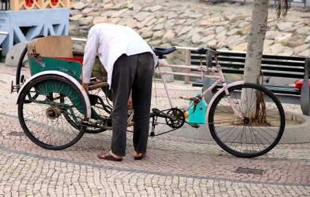Macau, April 2, 2012 - A rickshaw in a street in Macauのeditorial素材