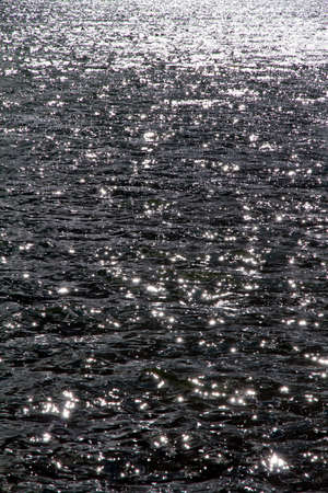 Sun reflections into a lakeの写真素材