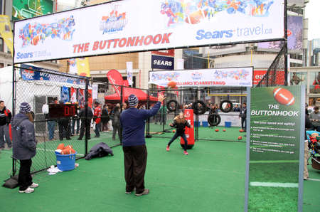 Toronto, Canada, November 23, 2012 - People in Dundas Square in Toronto celebrating the Gray Cup...