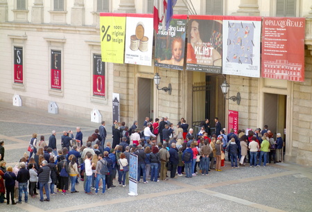 MILAN, ITALY - APRIL 12, 2014  People lining up at the Palazzo Reale entrance in Milan  The Royal...