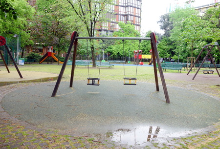 kids playground in a rainy day of Spring in Milan, Italyの写真素材