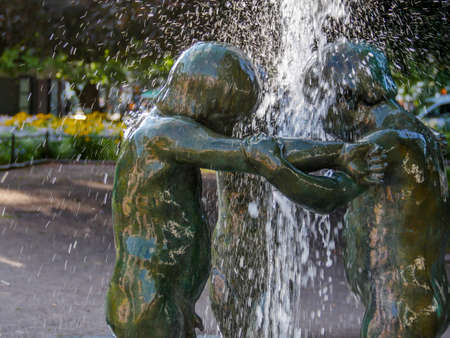 A concept shot of a child statues holding hands, the photograph was taken in the city of Malmo, Sweden.の写真素材