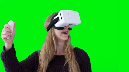 Woman using white VR headset and controller