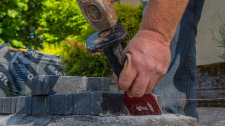 bricklayer tools man working on construction siteの写真素材