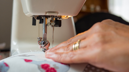 sewing machine stitching fabicの写真素材