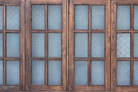 Wooden window with stainglassの写真素材