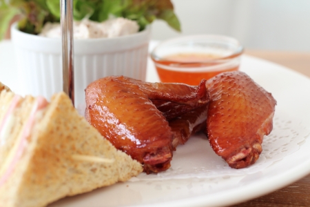 Grilled chicken wings with sandwich on tea time.の写真素材