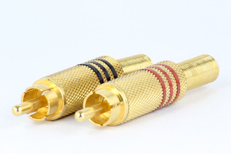 Golden plated RCA jacks isolated on white.