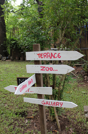 White wooden sign in the garden.の写真素材
