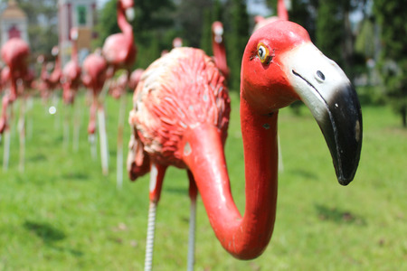 Red flamingos statue in the park.の写真素材