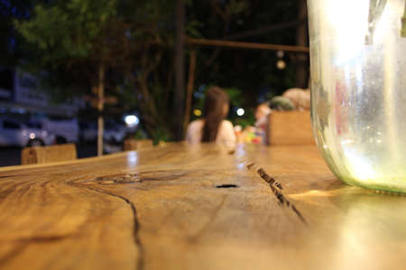 Wooden table, focus at hole on board.の写真素材