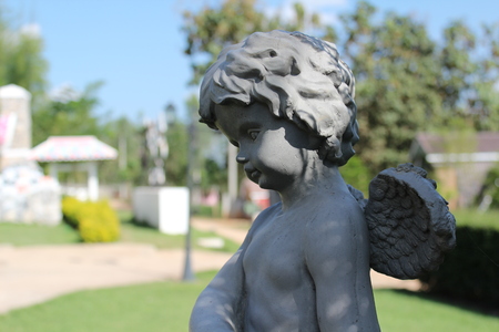 Boy cupid statue in the garden
