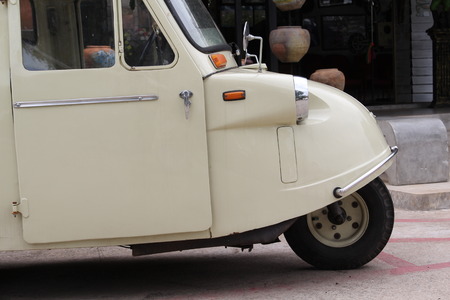 Old white Tuk Tuk taxi in Thailand.