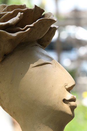 Closeup image of clay doll in the garden.の写真素材