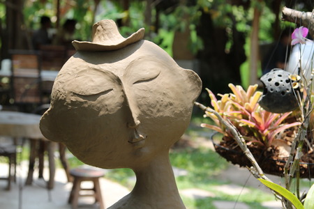 Closeup image of clay doll in the garden.の写真素材