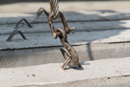 Hook crane working in construction site.
