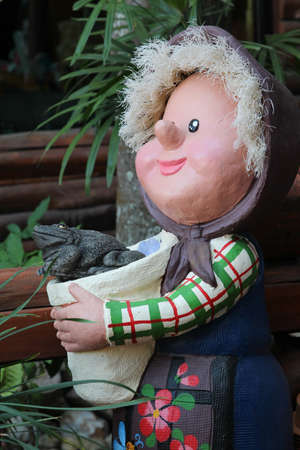 Grandmother doll standing in the garden.の写真素材