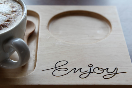 Saucer made from wood and coffee cup.の写真素材