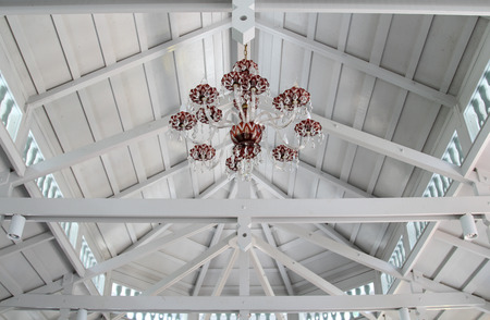 Chandelier on white roofing structure.の写真素材