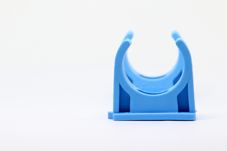 Plastic pipe clip isolated on white background.の写真素材