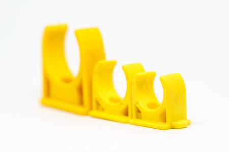Plastic pipe clip isolated on white background.の写真素材