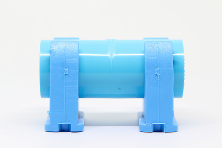Plastic pipe clip with socket PVC isolated on white background.の写真素材