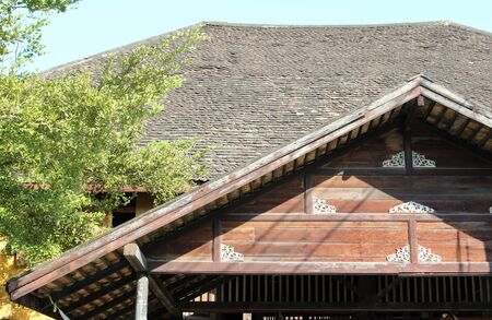 Old seasoned wooden shingle tiled roof.