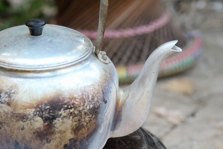 Old aluminium kettle on stove.の写真素材