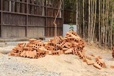 Orang brick pile in construction site.の写真素材