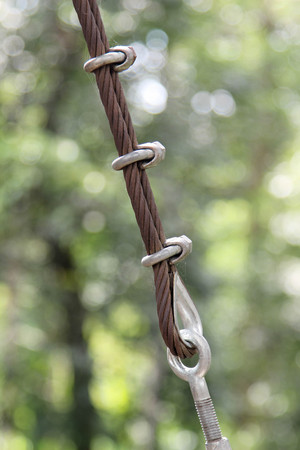 Closeup image of steel guy wire fittings installation.の写真素材