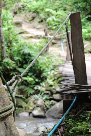 Old small bamboo bridge in countryside.の写真素材