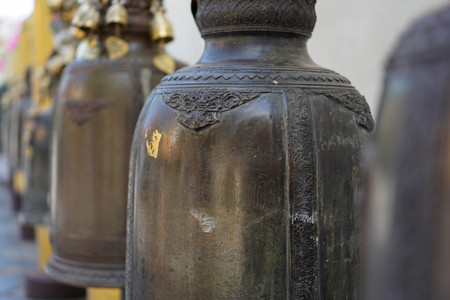 Many big brass bells in the temple.